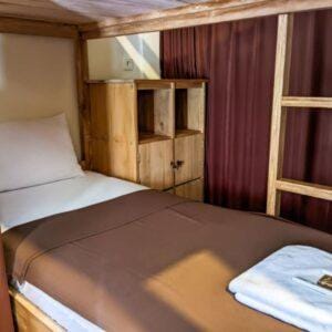 Backpacker package dorm bed at Racottage Mandalika budget surf stay in Kuta Lombok near Mandalika Circuit