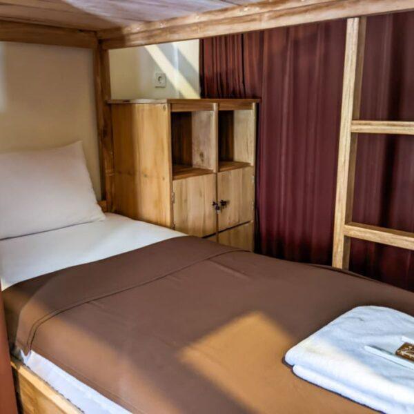 Backpacker package dorm bed at Racottage Mandalika budget surf stay in Kuta Lombok near Mandalika Circuit