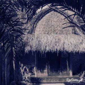 RaCottage Mandalika backpacker eco hotel Lombok with traditional thatched roof and lush tropical garden near Kuta Selatan surf spots
