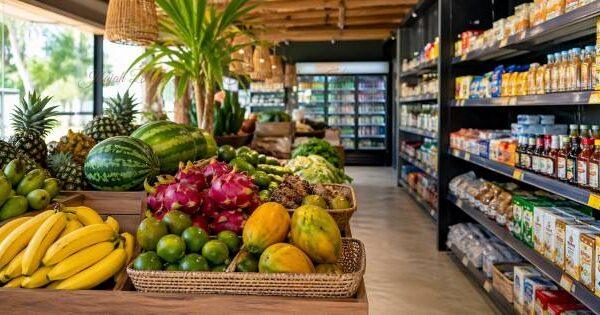 Fresh tropical fruits and grocery shelves inside a small modern market in Kuta Lombok