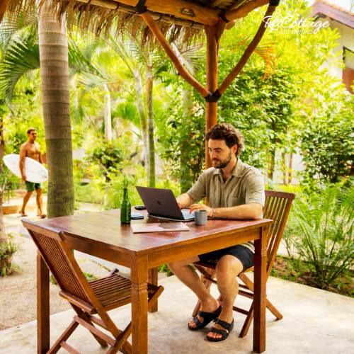 Remote work setup in Kuta Lombok with a laptop workspace at RaCottage Mandalika Hotel