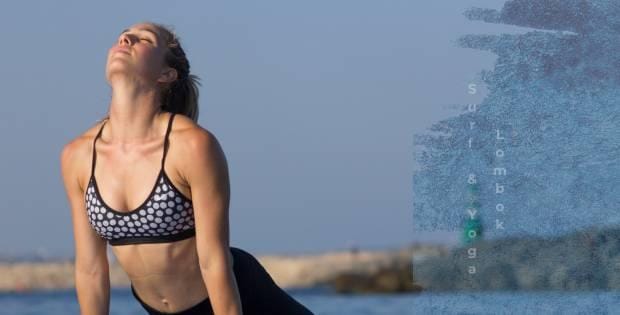 Woman stretching in upward-facing dog yoga pose by the sea during a Lombok Surf and Yoga Retreat session
