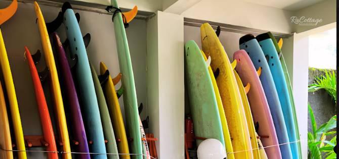 Surf camp in Kuta Lombok (RaCottage Mandalika) surfboard rack with multiple beginner and intermediate boards ready for Gerupuk sessions