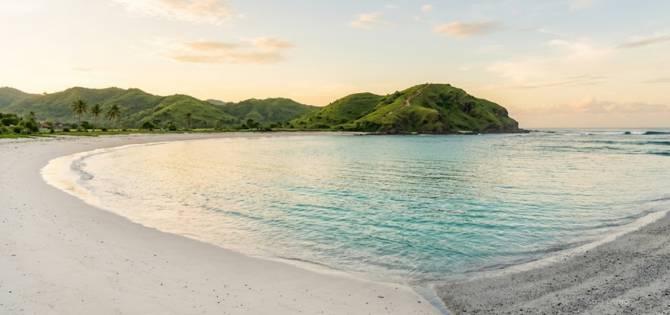 Tanjung Aan Beach The Most Stunning Beach Near Kuta Lombok and How to Go Without the Crowds 1 Pristine Tanjung Aan Beach bay, Lombok empty at sunrise